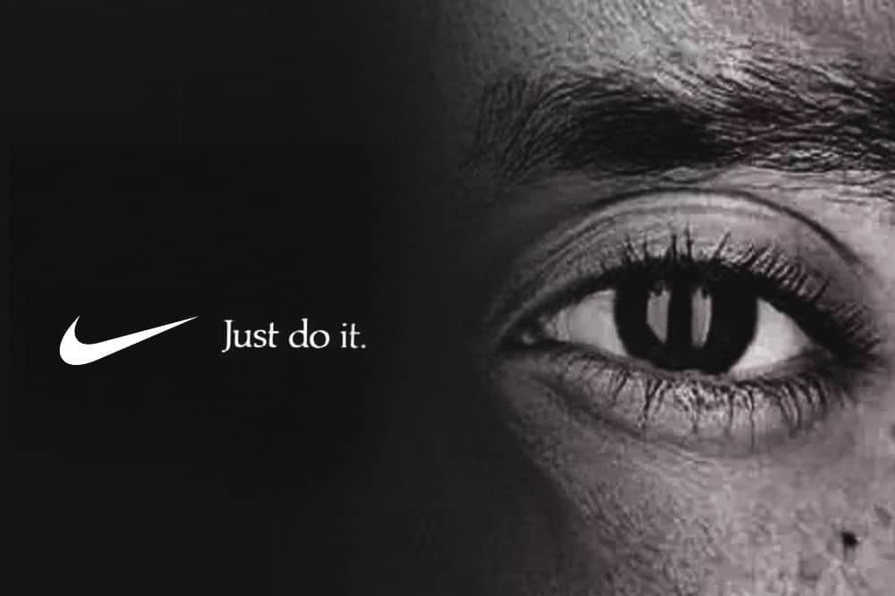 Black and white Nike advertisement featuring football player Colin Kaepernick’s eye and “Just do it.” slogan.
